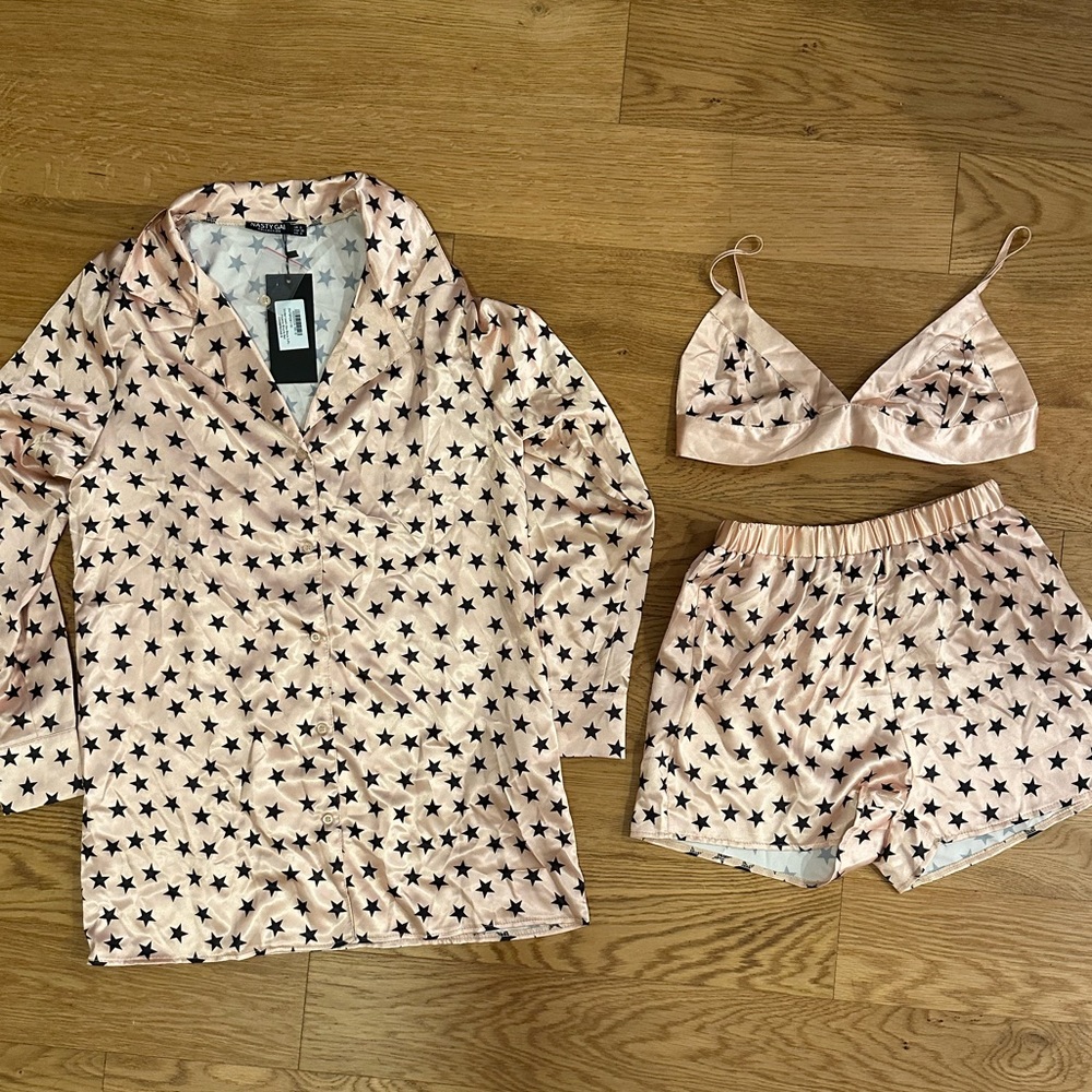 Brand new silk star PJ set. Champagne/pinkish and black.